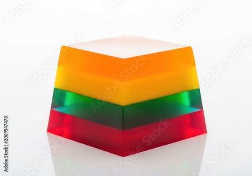 Vibrant and sweet gelatin dessert cubes reflecting light, showcasing layers of delicious flavors, an irresistible fruity treat for summer, wobble, satisfying, fresh