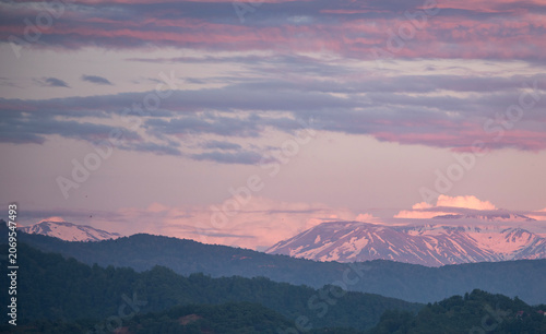 Sunset with clouds over the mountains.