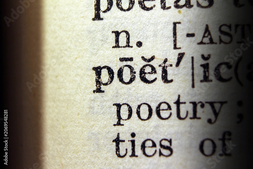 Photos Word poetic on dictionary page, macro close up