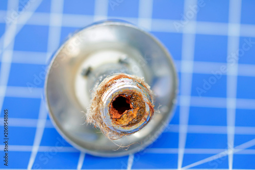 Foto Rust buildup, clog in a combination angle valve for the dishwasher connection