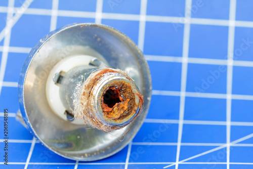 Schilderij op canvas Rust buildup, clog in a combination angle valve for the dishwasher connection
