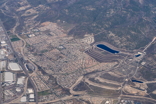 Aerial view of the Devil Canyon Power Plant and afterbay, part of California State Water Project, with the University Heights and Verdemont neighborhoods of San Bernardino visible below Devils Canyon