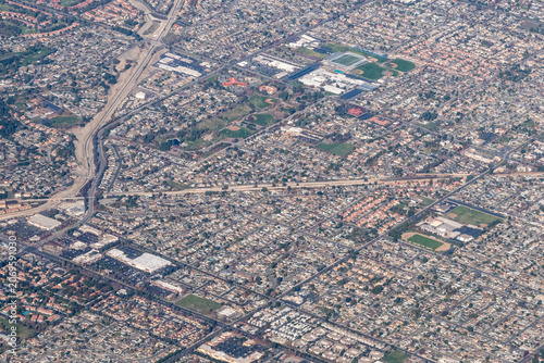 Aerial view of a suburban neighborhood in Alta Loma, Rancho Cucamonga, with Alta Loma High School and Cucamonga Middle School athletic fields visible, alongside a flood control channel, San Bernardino