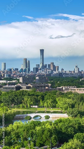 Large white clouds roll across the Beijing skyline as rain clouds dissipate, creating a daytime atmospheric cityscape time-lapse.