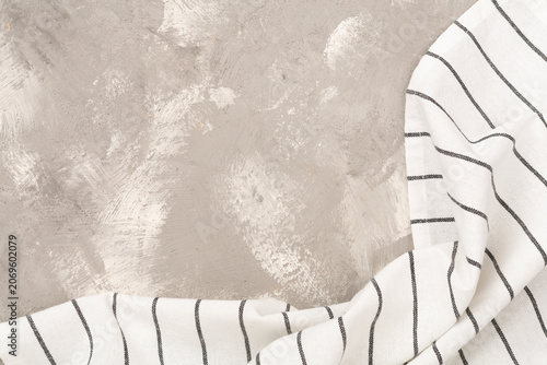 Kitchen napkin on concrete background, top view