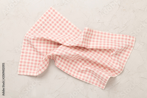 Kitchen napkin on concrete background, top view