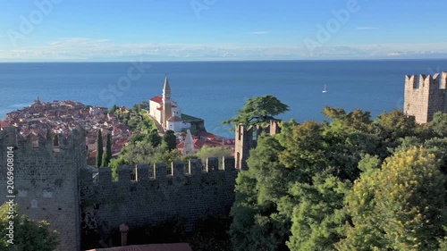 Aerial view of Piran Old Town From the Remains of City Wall. Beautiful Coastal City in Slovenia at Sunny evening.