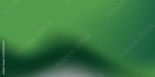Abstract blurred gradient mesh background in green.