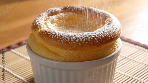 Fluffy soufflé cake in white ceramic ramekin