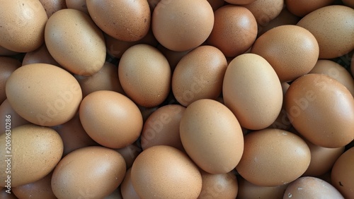 Top view of fresh brown chicken eggs background texture, natural raw ingredients for cooking.