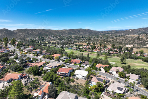 Aerial view of Ramona neighborhood with mountain, valley and San Vicente Golf Course, in California, USA