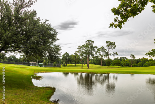 Scenic Golf Course Pond and Water Hazard with Tree Reflections at a Country Club in Tyler Texas