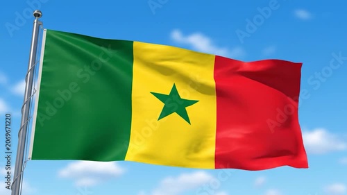 The national flag of Senegal waving on a pole against a blue sky