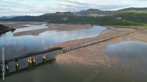 Aerial view of Barmouth Bridge and moored boats at Mawddach Estuary