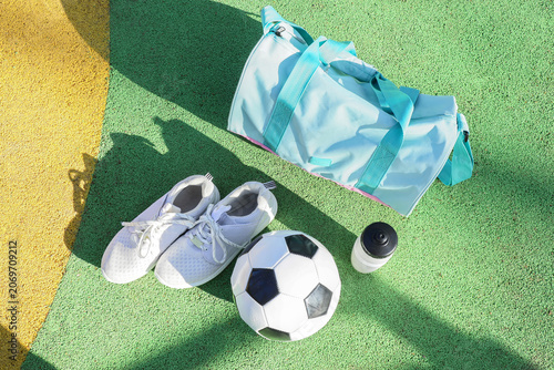 Gym bag with sneakers, wate...