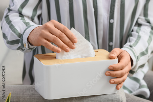 Woman taking paper napkin f...