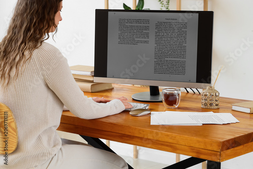 Female writer editing text ...