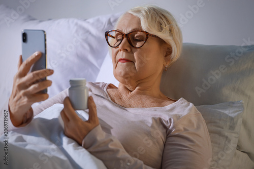 Senior woman with mobile ph...