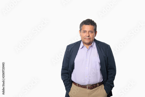 60-year-old Latino man with dark skin appears happy and at peace, enjoying a successful professional and personal life