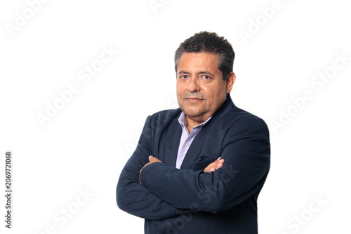 60-year-old Latino man with dark skin appears happy and at peace, enjoying a successful professional and personal life