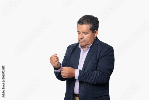 60-year-old Latino man with dark skin appears happy and at peace, enjoying a successful professional and personal life