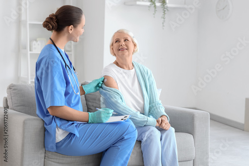 Senior woman receiving medi...