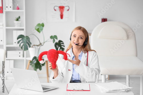 Female gynecologist with kn...