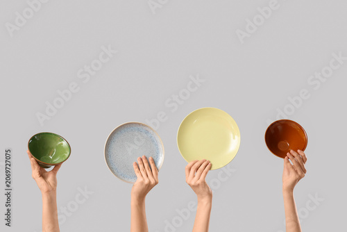 Female hands with bowls and...