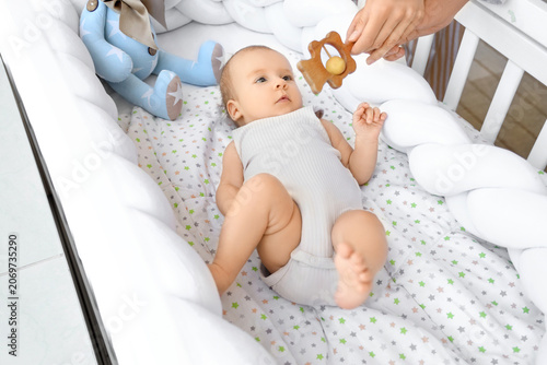 Young parents with rattle a...