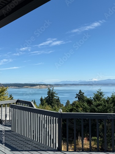 Ocean and snow capped mountain views from an outdoor deck