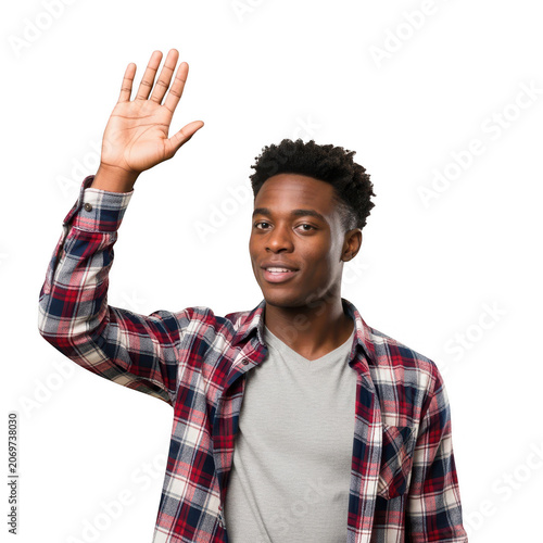 Young black man wearing a plaid shirt waving his hand to say hello