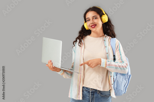 Female student in headphone...