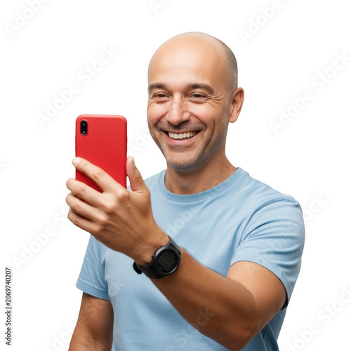 Happy man looking at his red smartphone and smiling