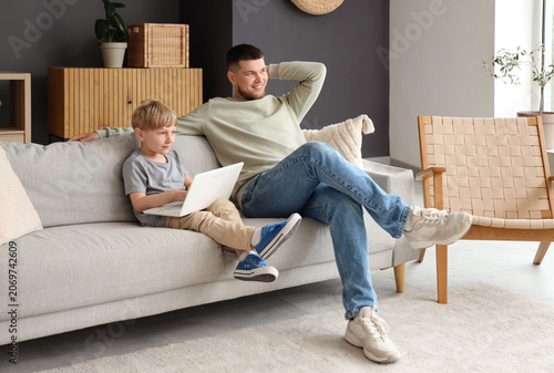 Young father and his son do...