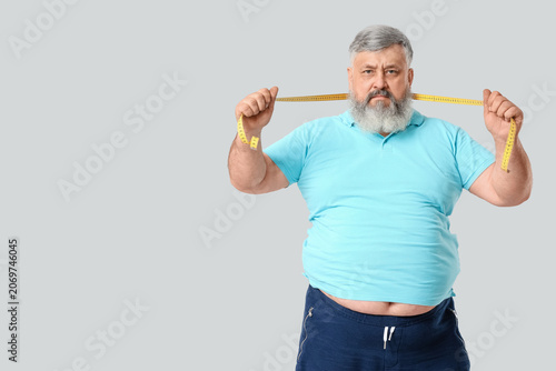 Overweight mature man with ...