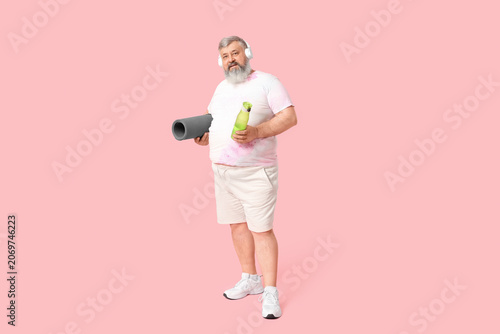 Overweight mature man in he...