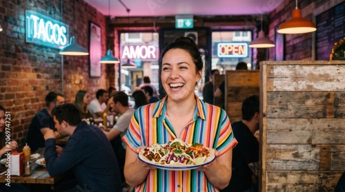 Happy Smiling Woman Holding a Plate of Fresh Mexican Tacos in a Lively Rustic Taco Bar Interior