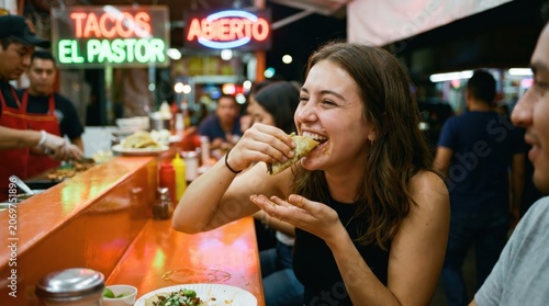 Young woman enjoying authentic street food at a lively night taco bar stand