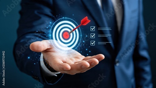 Hand holding glowing target with arrow hitting bullseye, business goal achievement, success strategy concept, mission accomplished, marketing objective