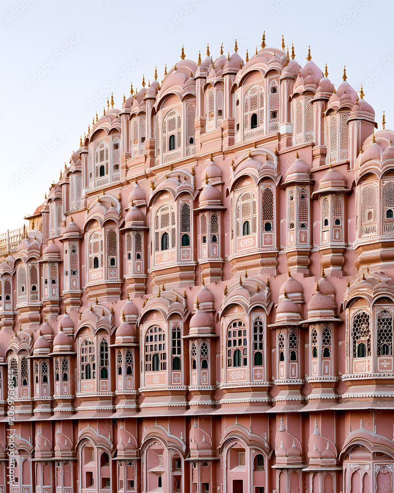 Obraz premium Ornate Pink Palace Facade in Jaipur, India Showcasing Historical Architecture and Detailed Design Elements