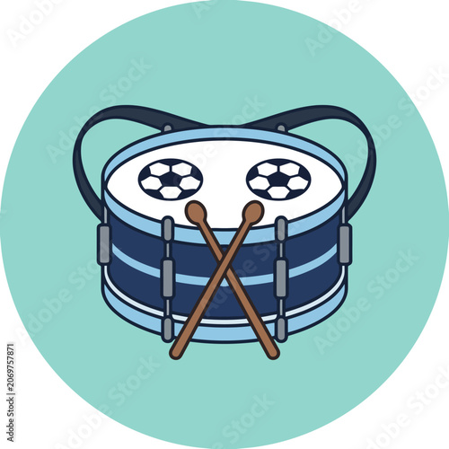 A blue marching drum with soccer ball patterns and drumsticks