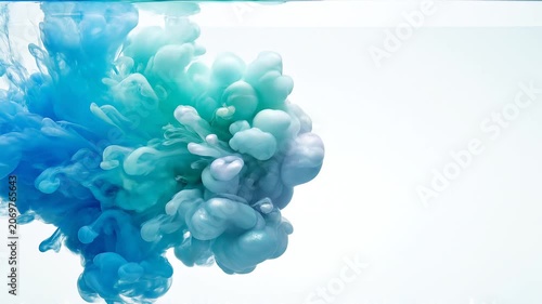 Blue and Green Ink Swirls in Water on White Background Abstract Background