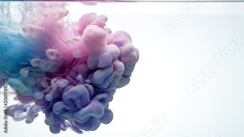 Colorful Paint Swirling in Water on White Background