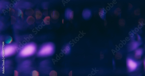 Blur flare light. Twinkle decorative. Defocused blue purple neon lens sparkle glare gleam optical shine glow on abstract bokeh dark black background.