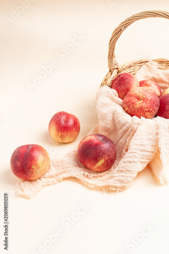 Konstfotografi Fresh nectarine against a beige background
