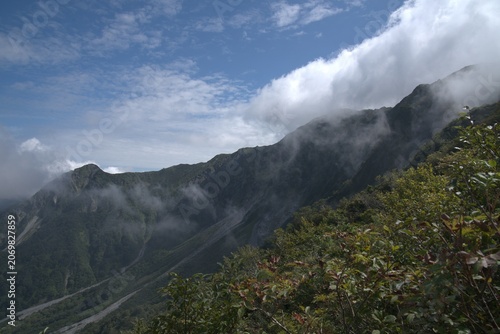 Clouds over mountain ridge in autumn, Japan