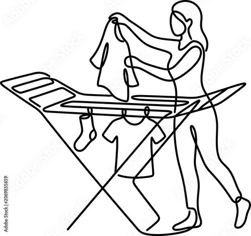 Continuous one line drawing of a woman hanging laundry on a drying rack.