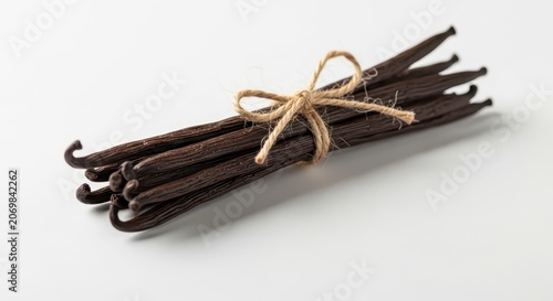 Vanilla beans tied with twine isolated.