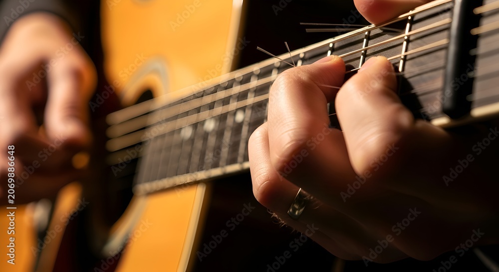 Fototapeta premium Acoustic Guitar Player's Hands: Musical Performance, Close-up