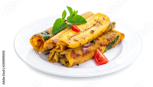 A stack of wrapped golden brown crepes on a white plate, garnished with mint and a tomato wedge